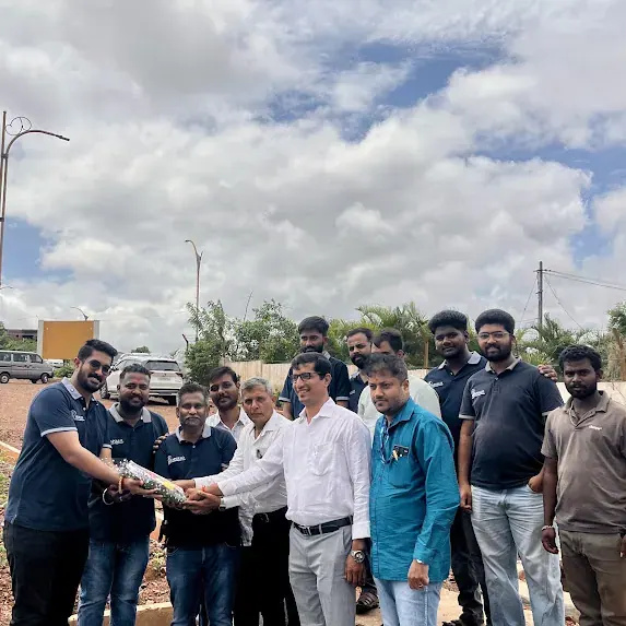 HDMC officials and the Apollo team at the sapling planting drive at Vijnana Nagara, Dharwad